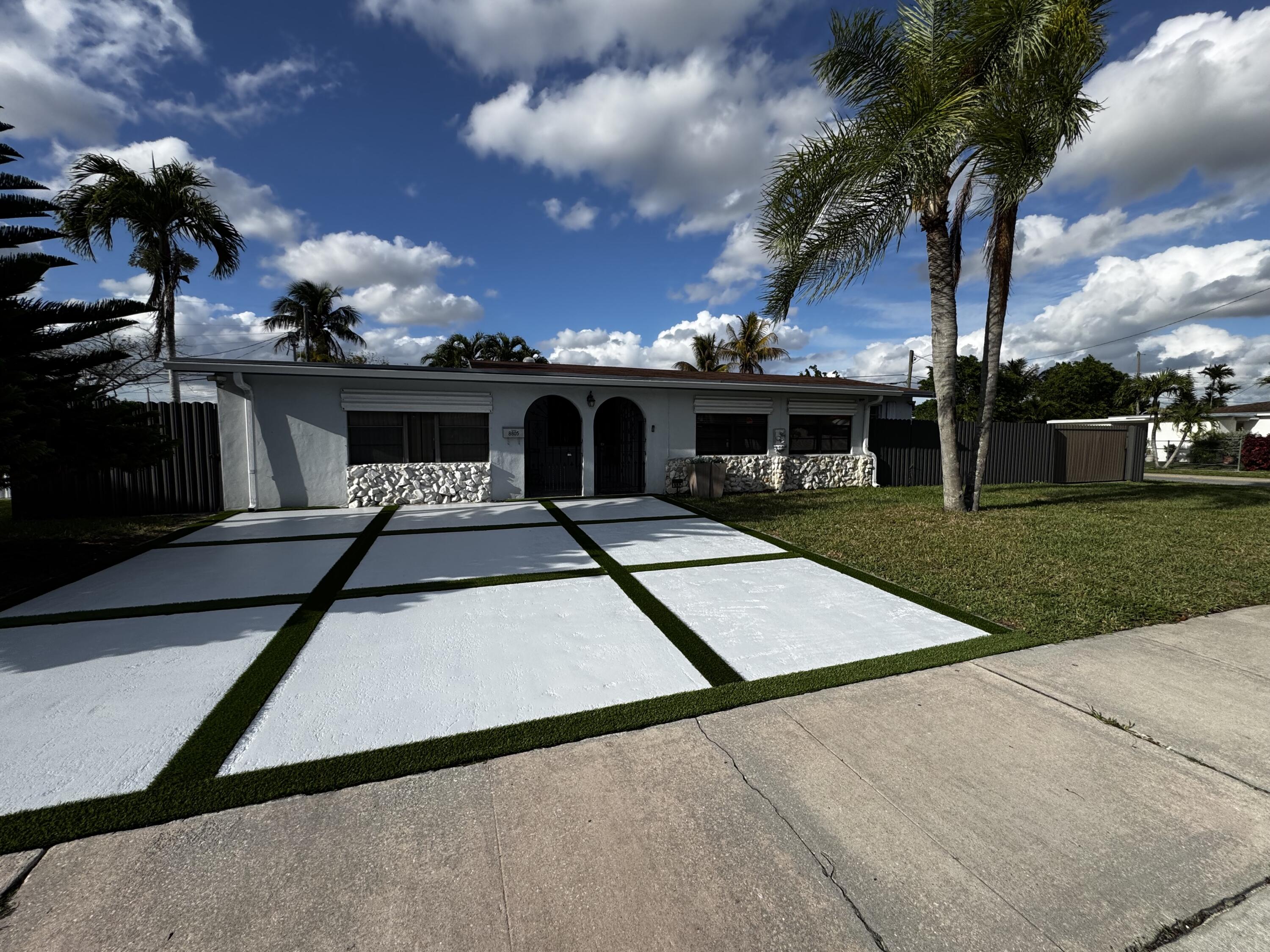 8805 Southwest 43rd Terrace Miami, FL 33165 - Photo 2 of 7 a view of a house with a yard
