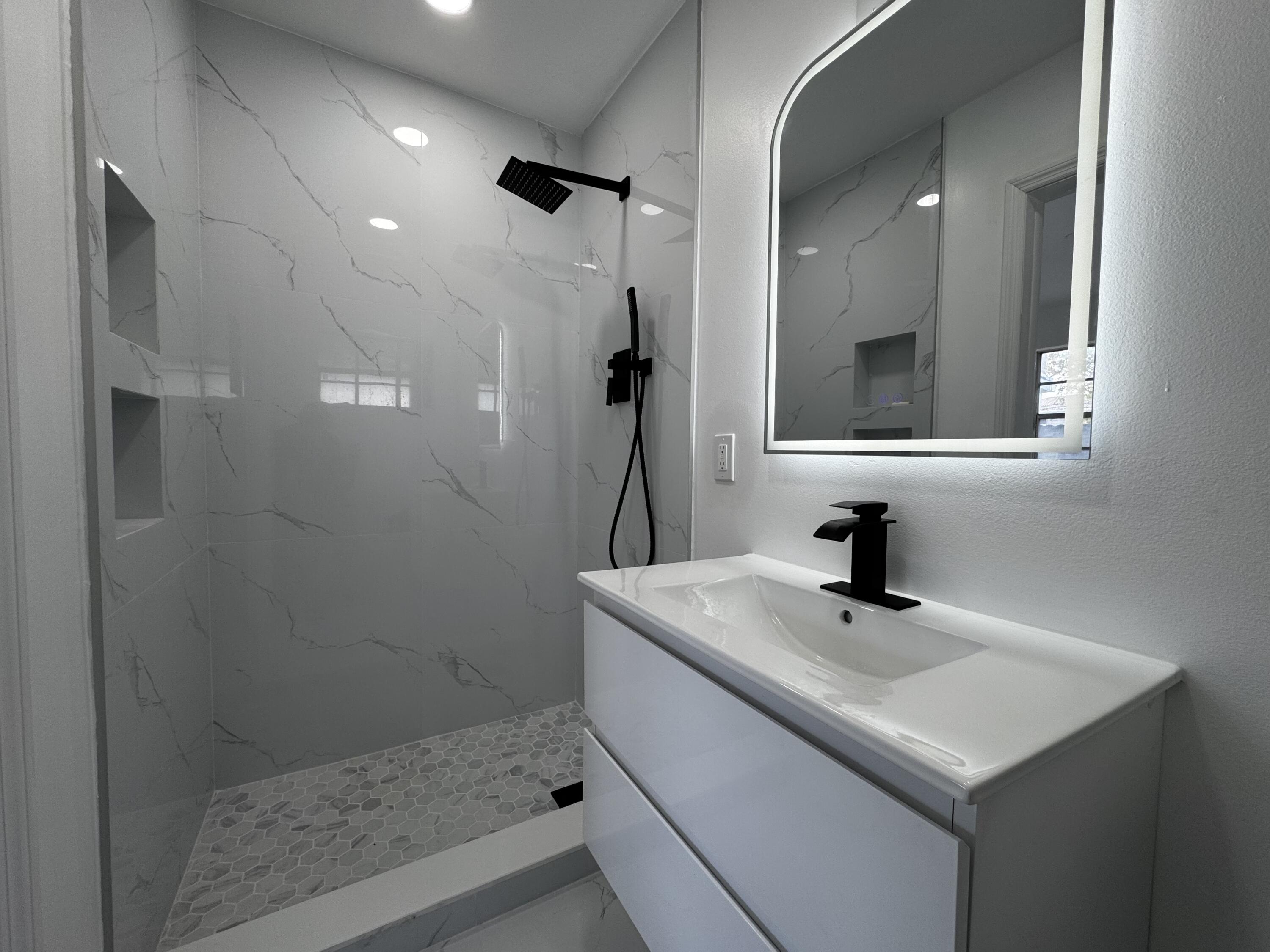 8805 Southwest 43rd Terrace Miami, FL 33165 - Photo 7 of 7 a bathroom with a sink and a mirror