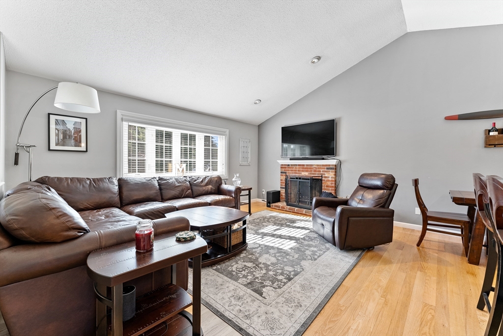 47 Deer Run Road West Springfield, MA 01089 - Photo 13 of 41 a living room with furniture a fireplace and a flat screen tv