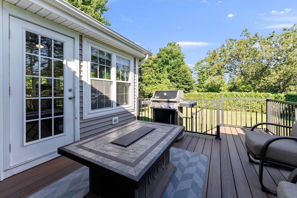 47 Deer Run Road West Springfield, MA 01089 - Photo 18 of 41 a view of a deck with couches table and chairs with wooden floor and fence