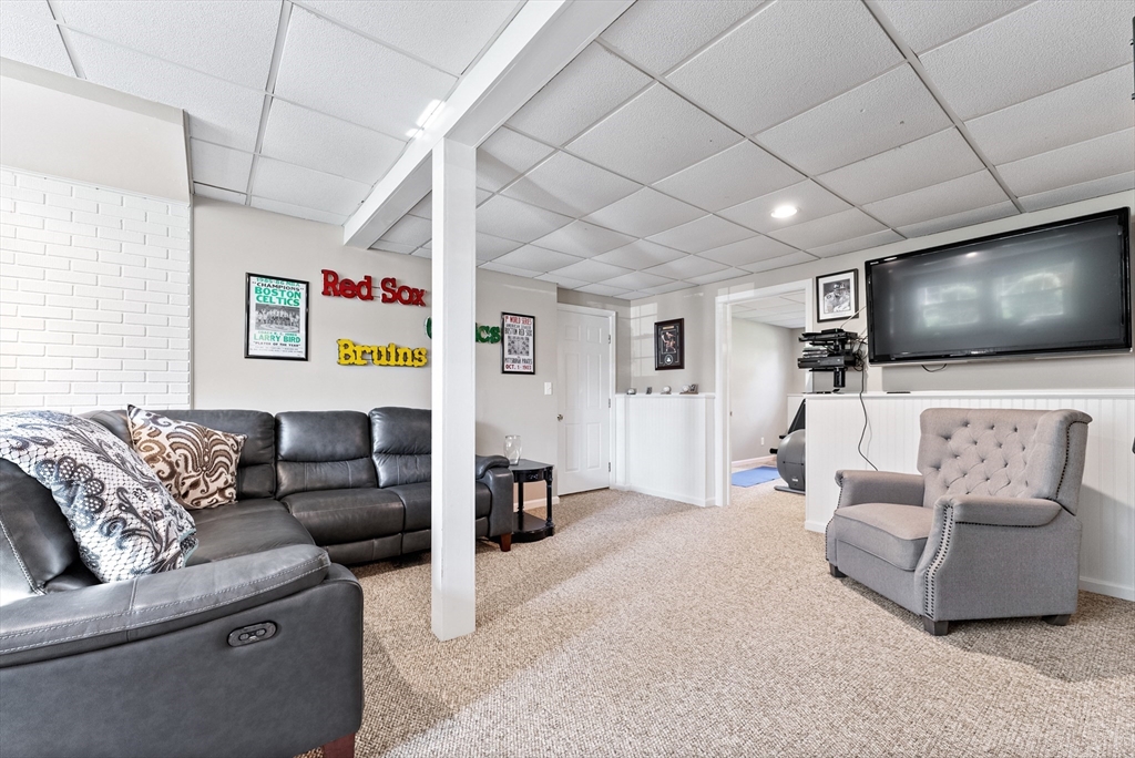 47 Deer Run Road West Springfield, MA 01089 - Photo 33 of 41 a living room with furniture and a flat screen tv