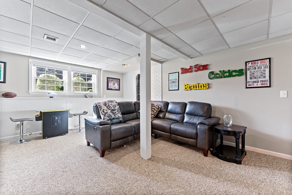47 Deer Run Road West Springfield, MA 01089 - Photo 34 of 41 a living room with furniture and a flat screen tv