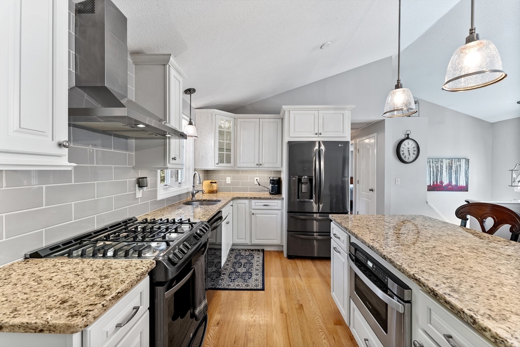 47 Deer Run Road West Springfield, MA 01089 - Photo 7 of 41 a kitchen with a stove and a kitchen view