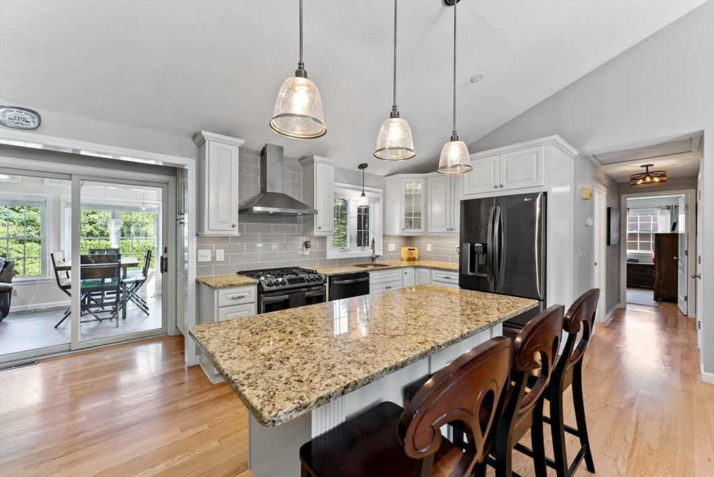 47 Deer Run Road West Springfield, MA 01089 - Photo 8 of 41 a kitchen with stainless steel appliances granite countertop a kitchen island a stove a table and chairs