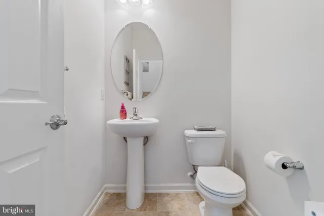 a view of hallway with wooden floor
