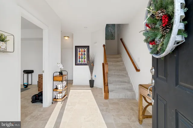 a living room with furniture and flowers