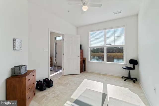 a view of workspace with wooden floor and windows