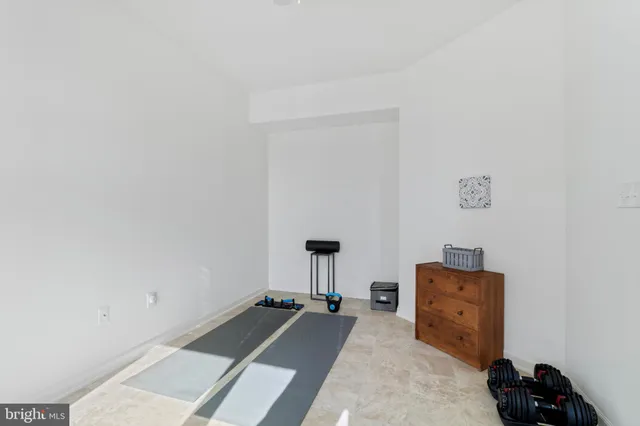 a room with a bed and a chandelier