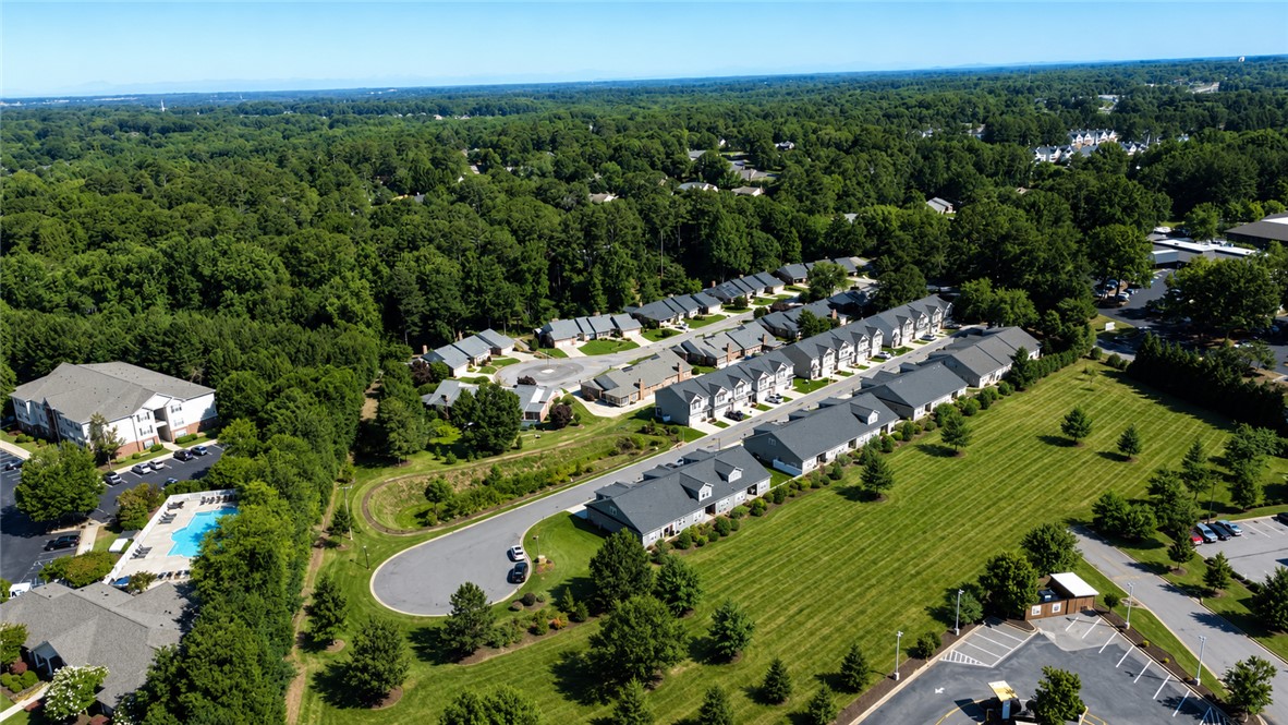102 Ventura Street Anderson, SC 29621 - Photo 22 of 24 An aerial perspective reveals a vibrant community nestled among lush green landscapes.