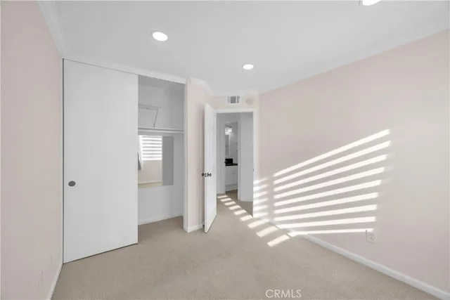 a view of a livingroom with entryway and a window