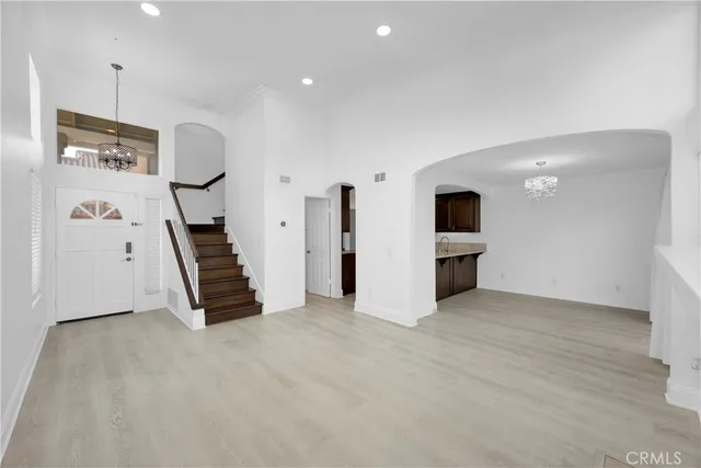 an empty room with windows and pillars