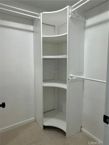 a view of an empty walk in closet