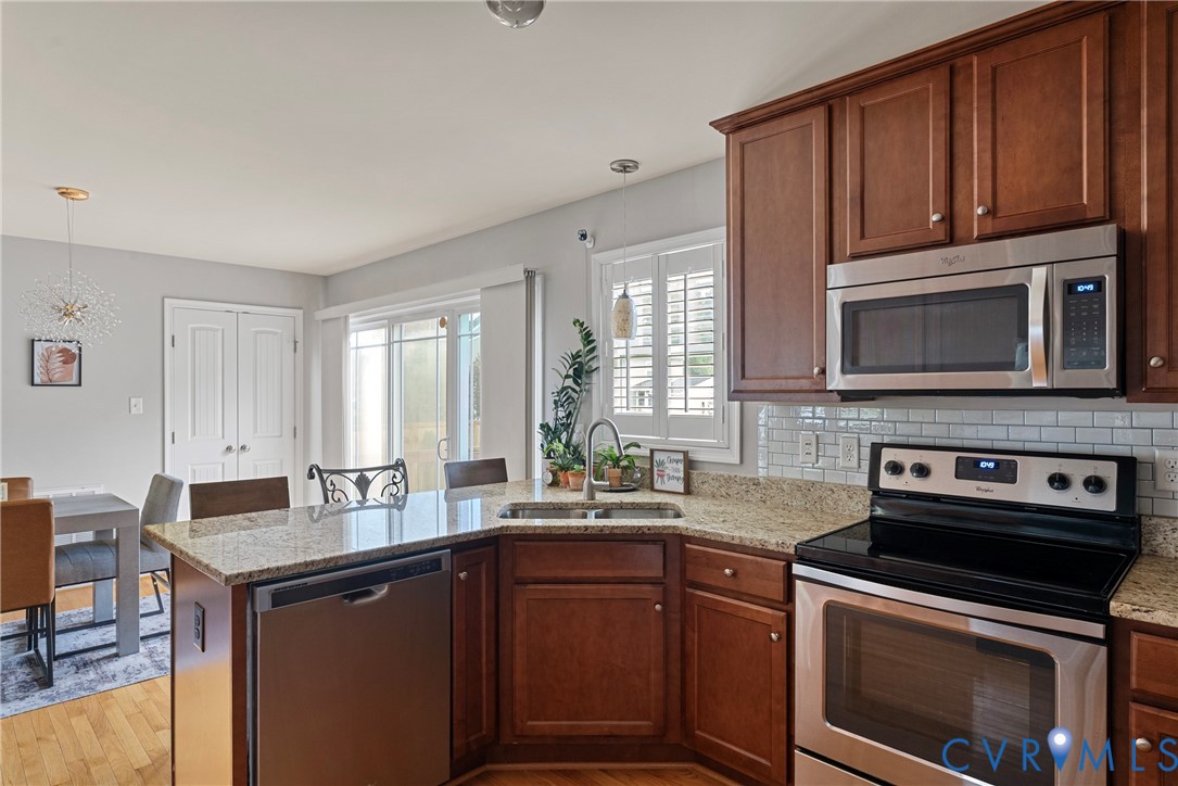 11223 Hill Ridge Court Ashland, VA 23005 - Photo 14 of 35 a kitchen with a sink stove and microwave