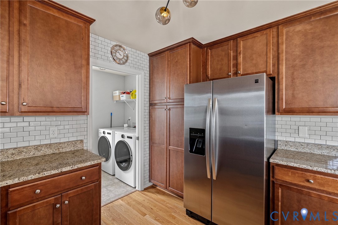 11223 Hill Ridge Court Ashland, VA 23005 - Photo 15 of 35 a kitchen with a refrigerator sink and cabinets