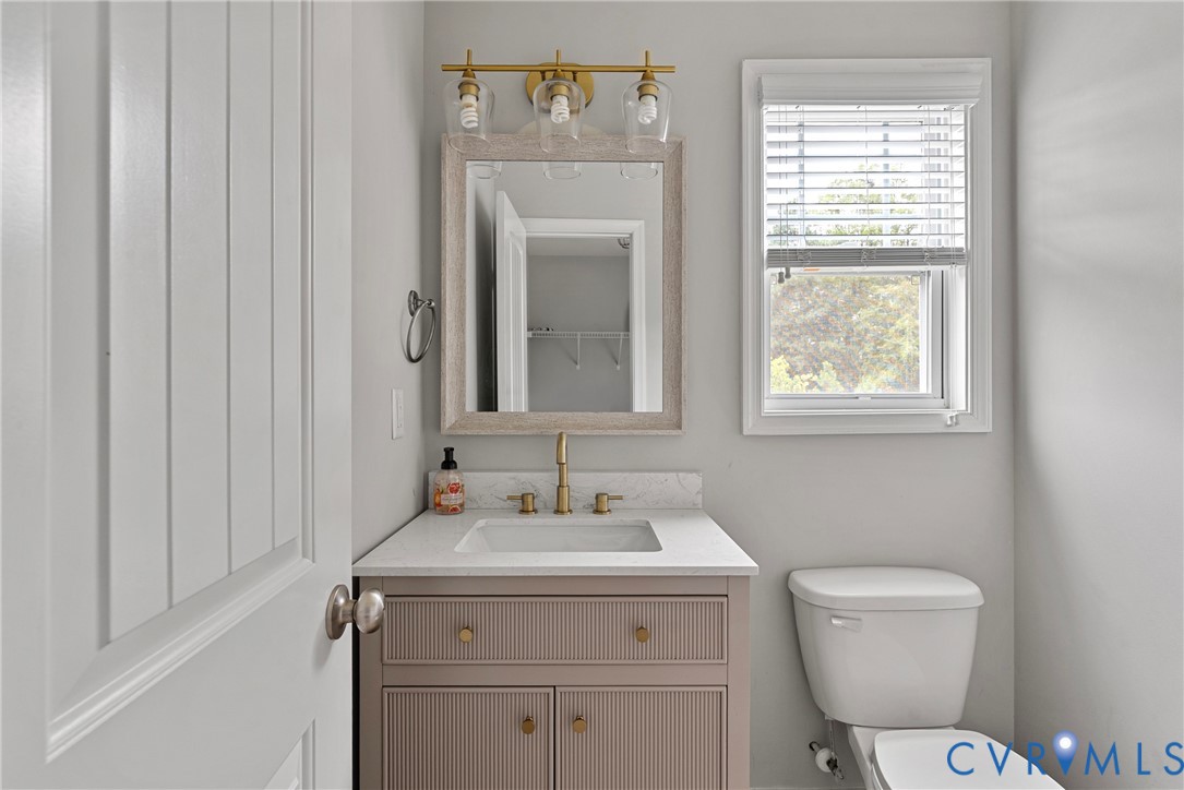 11223 Hill Ridge Court Ashland, VA 23005 - Photo 17 of 35 a bathroom with a toilet sink and mirror