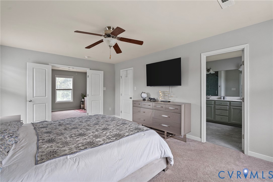 11223 Hill Ridge Court Ashland, VA 23005 - Photo 23 of 35 a bedroom with a bed and a flat screen tv