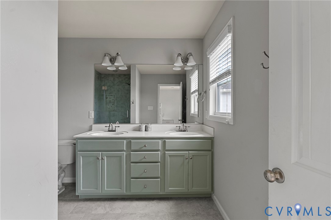 11223 Hill Ridge Court Ashland, VA 23005 - Photo 24 of 35 a bathroom with a double vanity sink and mirror
