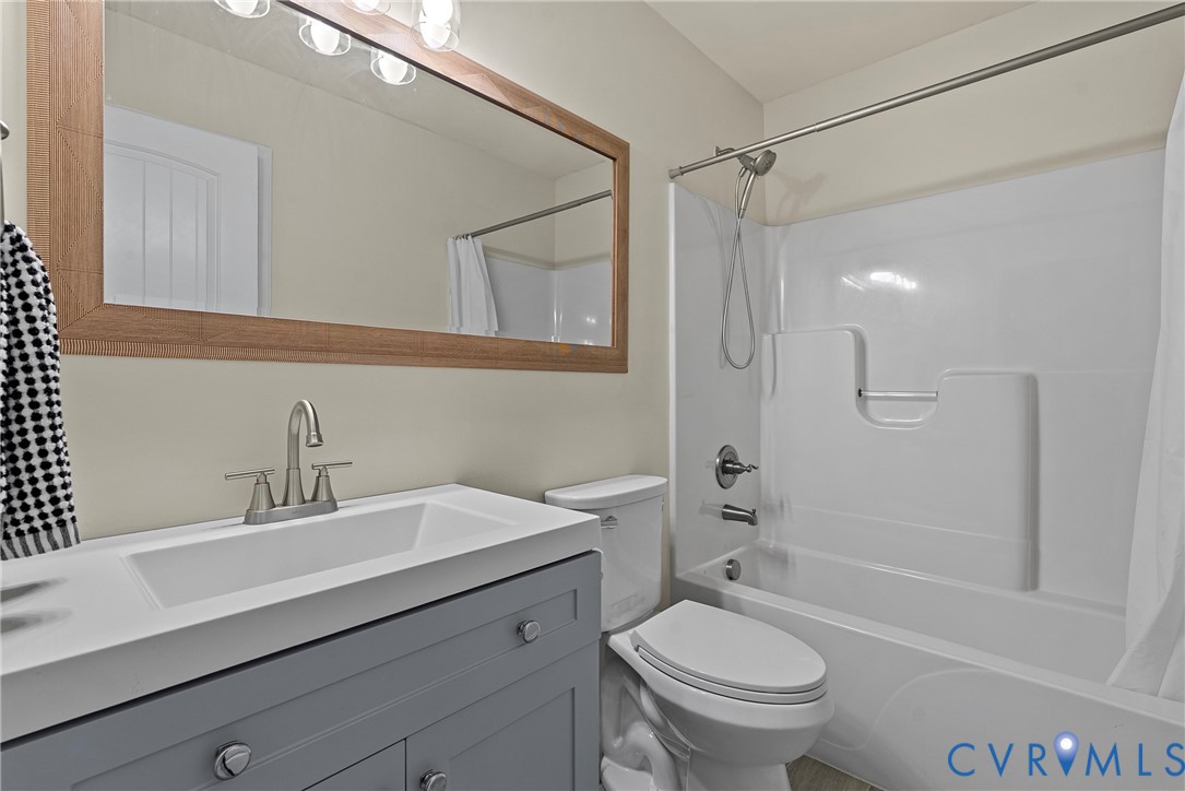 11223 Hill Ridge Court Ashland, VA 23005 - Photo 27 of 35 a bathroom with a sink a toilet and shower