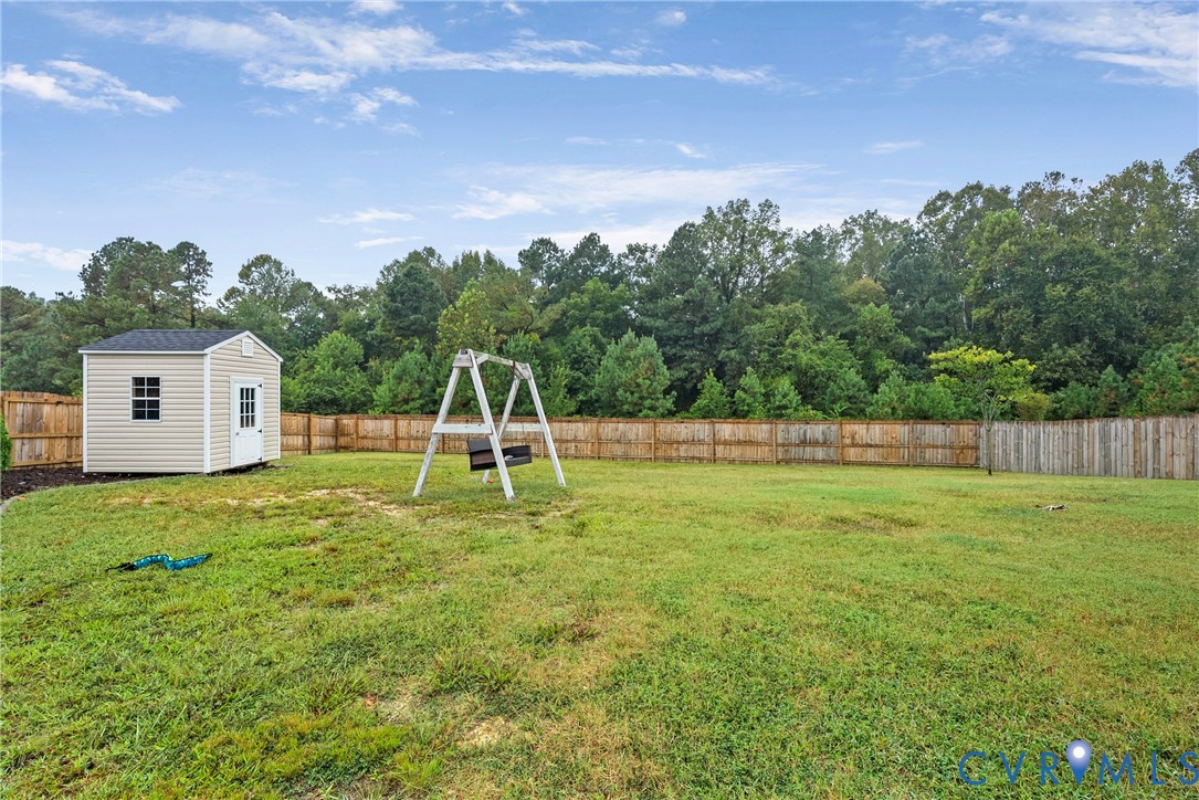 11223 Hill Ridge Court Ashland, VA 23005 - Photo 32 of 35 a view of a house with a backyard and a tree