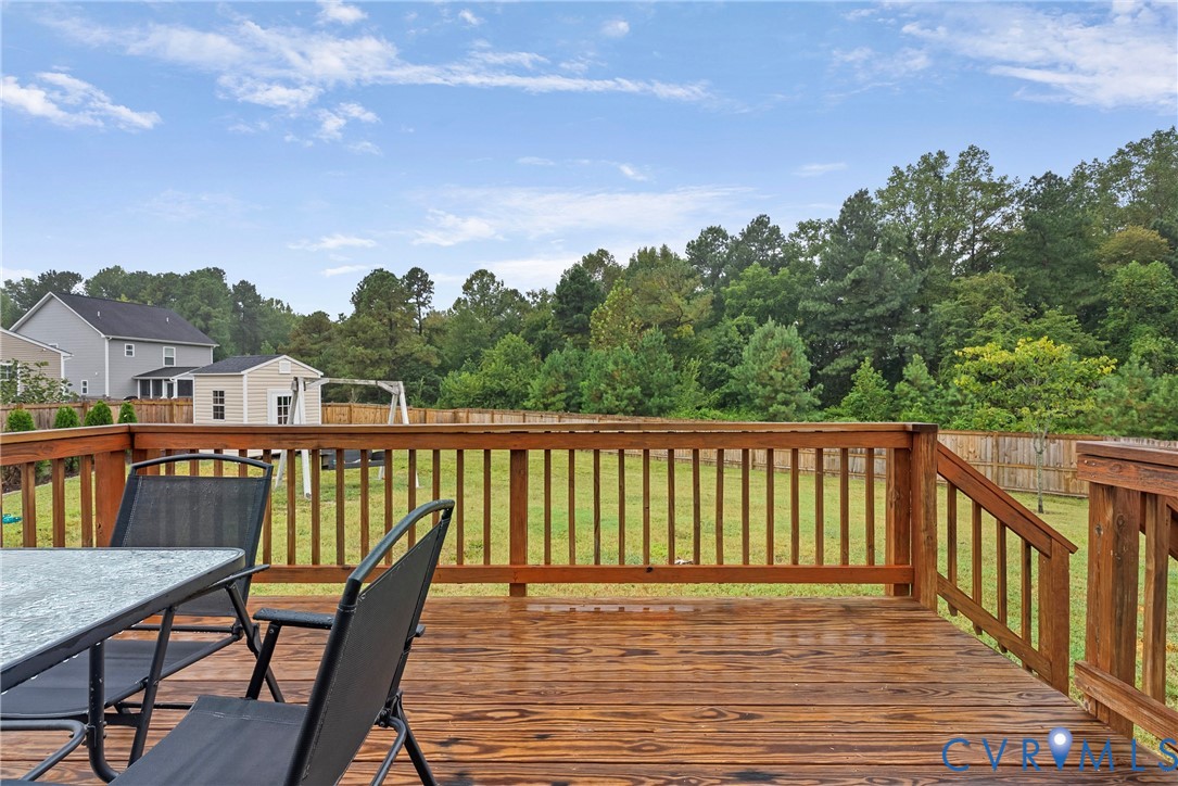 11223 Hill Ridge Court Ashland, VA 23005 - Photo 34 of 35 a balcony with wooden floor and city view