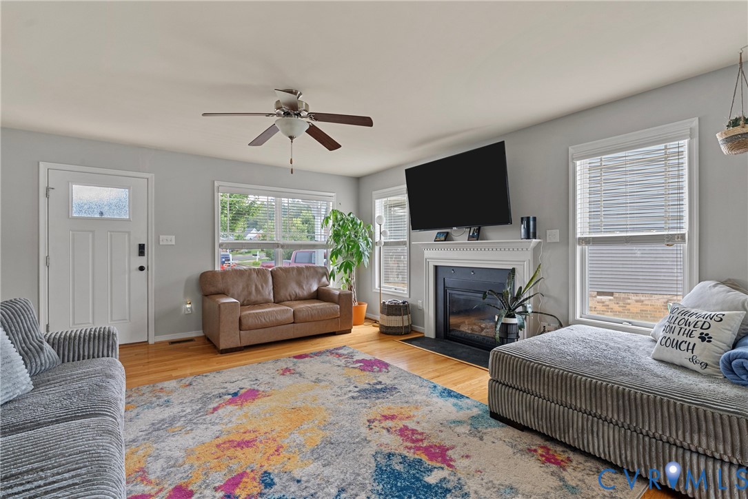 11223 Hill Ridge Court Ashland, VA 23005 - Photo 6 of 35 a living room with furniture a flat screen tv and a fireplace