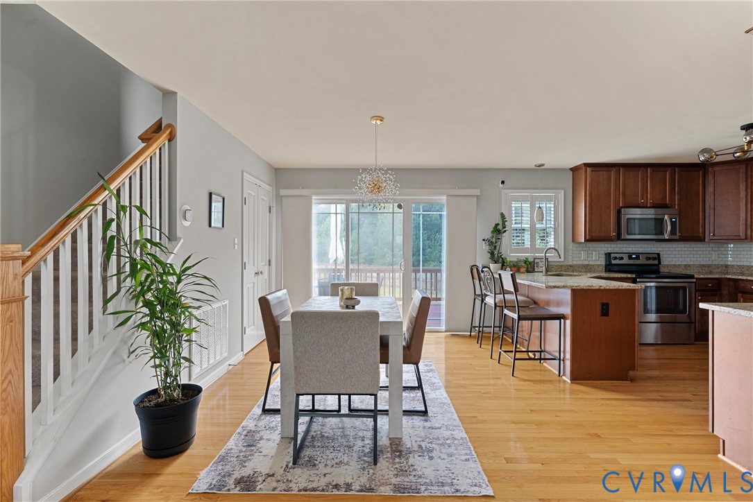 11223 Hill Ridge Court Ashland, VA 23005 - Photo 8 of 35 a view of a dining room with furniture window and outdoor kitchen