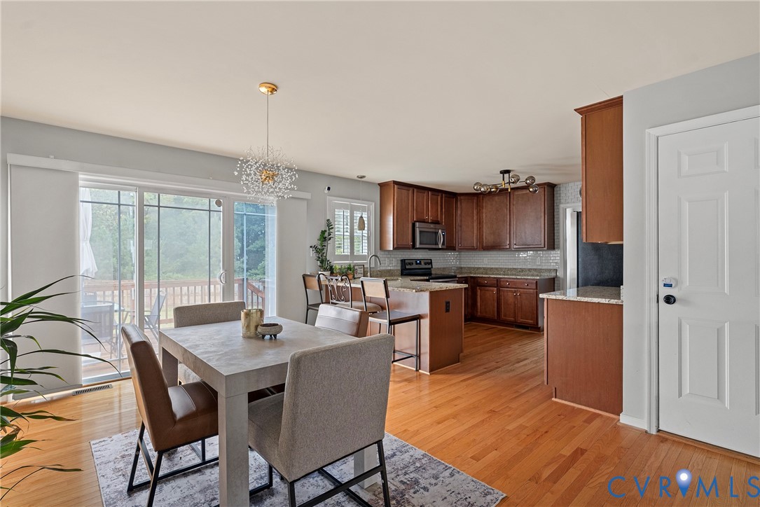 11223 Hill Ridge Court Ashland, VA 23005 - Photo 9 of 35 a kitchen with a table and chairs in it