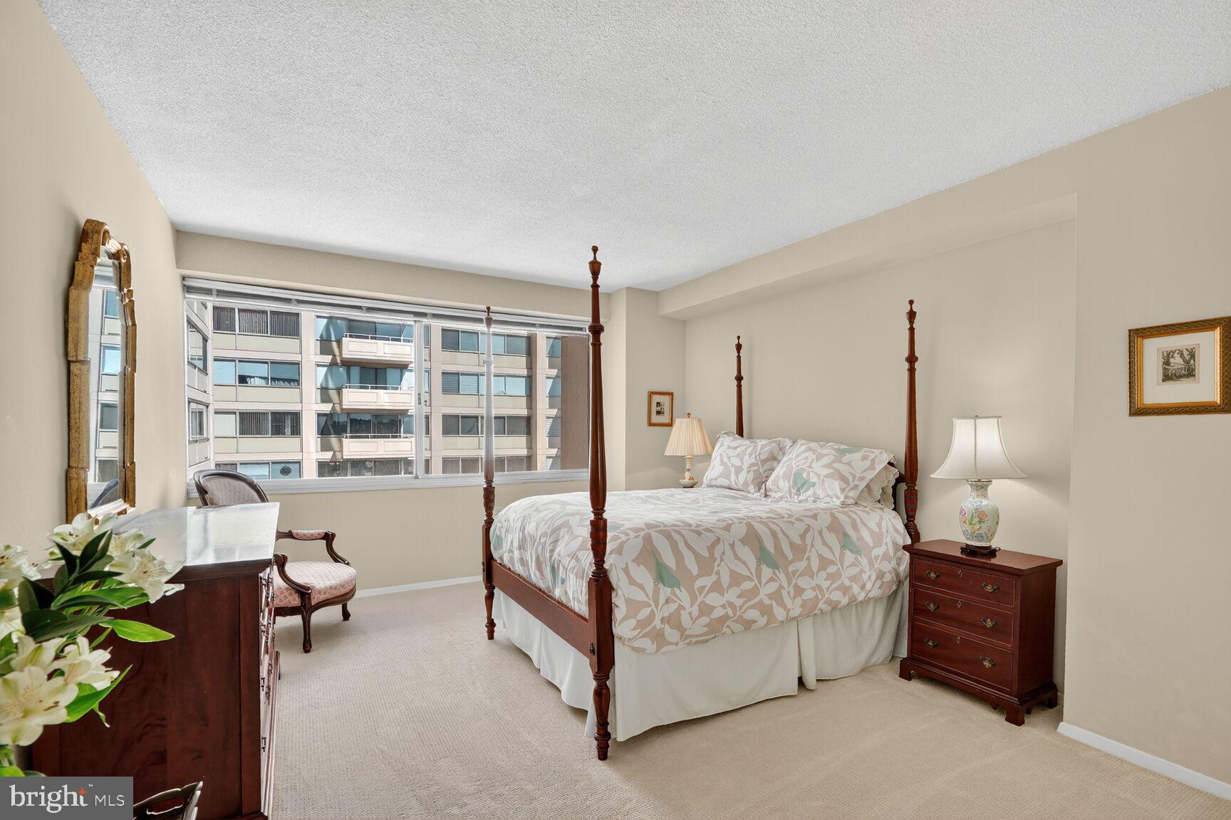 4515 Willard Avenue, Unit 1421S Chevy Chase, MD 20815 - Photo 14 of 53 a bed room with a bed and a large window