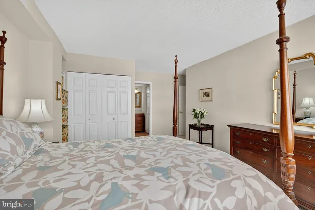 a bed room with a bed and a lamp