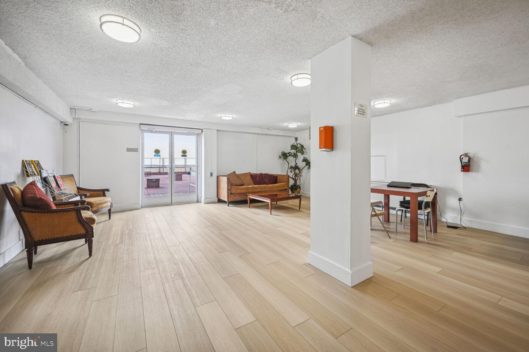 4515 Willard Avenue, Unit 1421S Chevy Chase, MD 20815 - Photo 25 of 53 a living room with furniture and a wooden floor