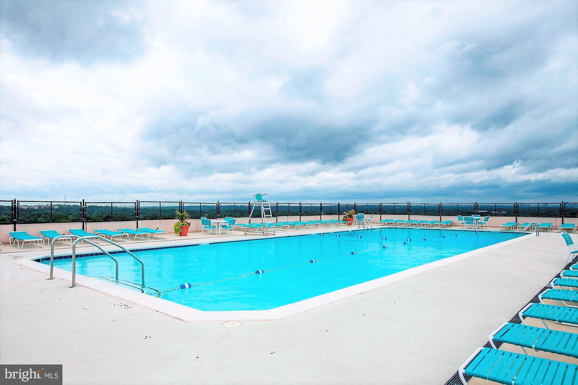 4515 Willard Avenue, Unit 1421S Chevy Chase, MD 20815 - Photo 29 of 53 a view of a swimming pool with an outdoor seating