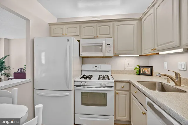 a view of a kitchen and living room