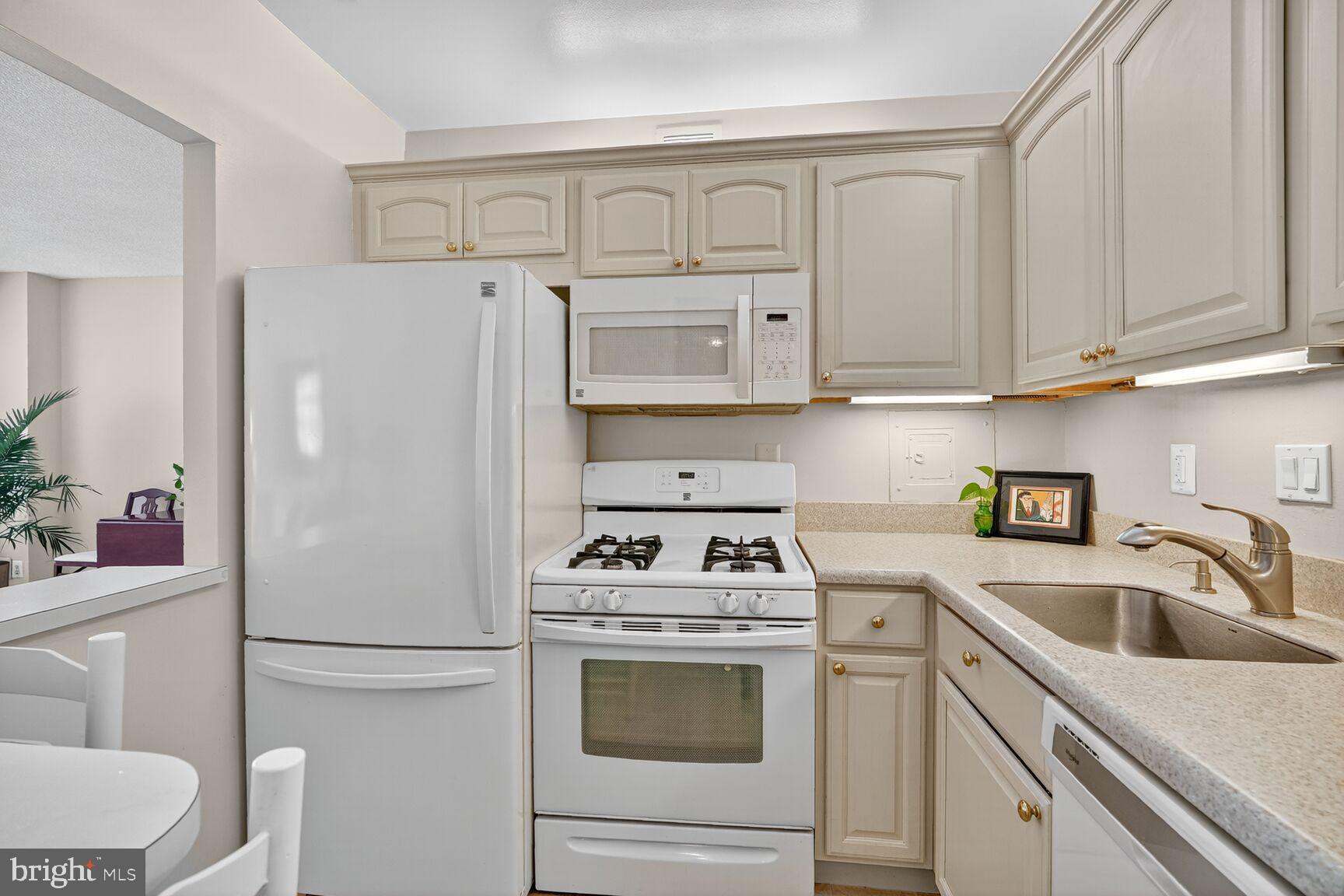 4515 Willard Avenue, Unit 1421S Chevy Chase, MD 20815 - Photo 8 of 53 a white refrigerator freezer sitting inside of a kitchen