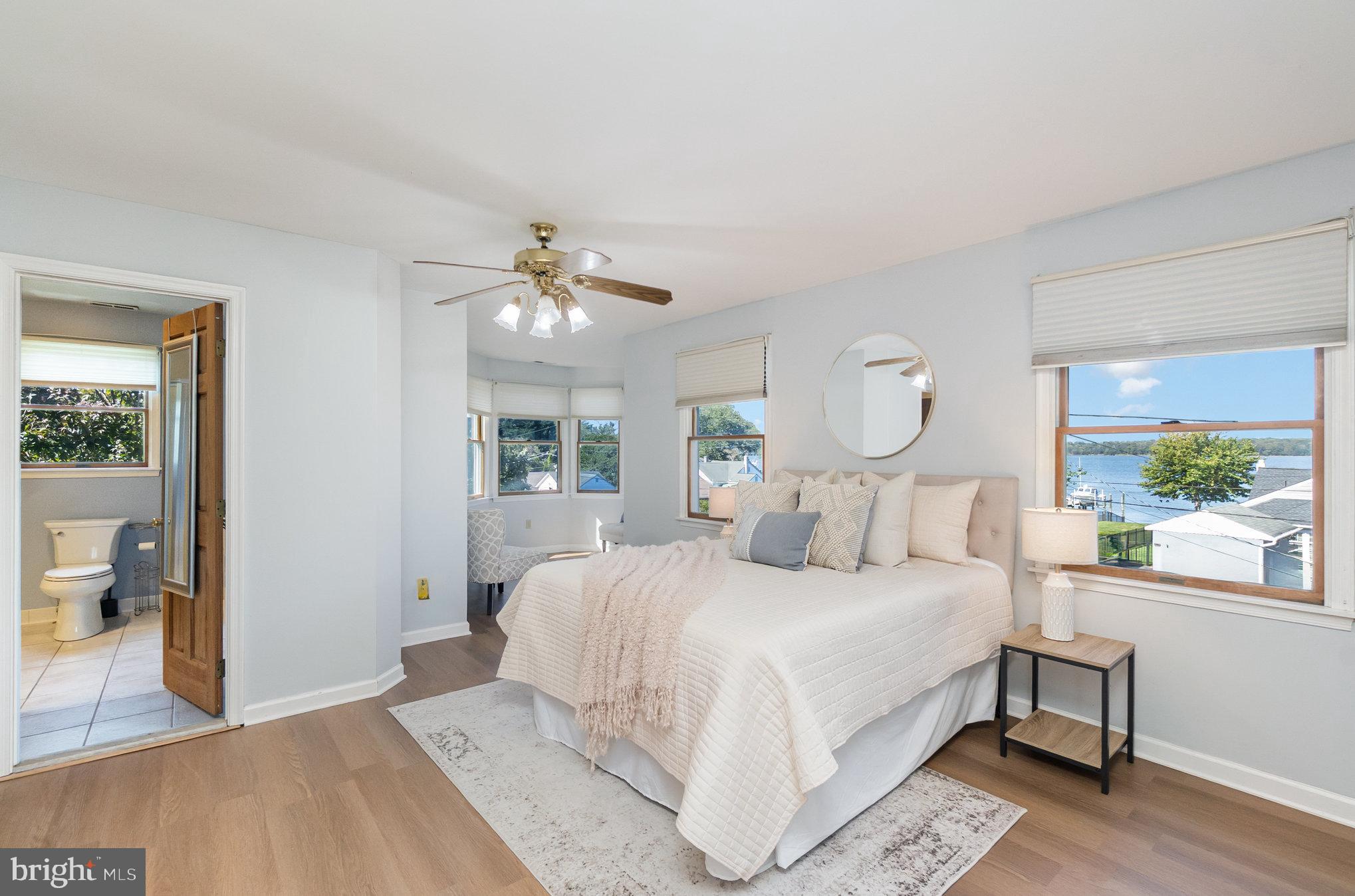 7401 Greenbank Road Baltimore, MD 21220 - Photo 20 of 58 a bedroom with a large bed and a chandelier