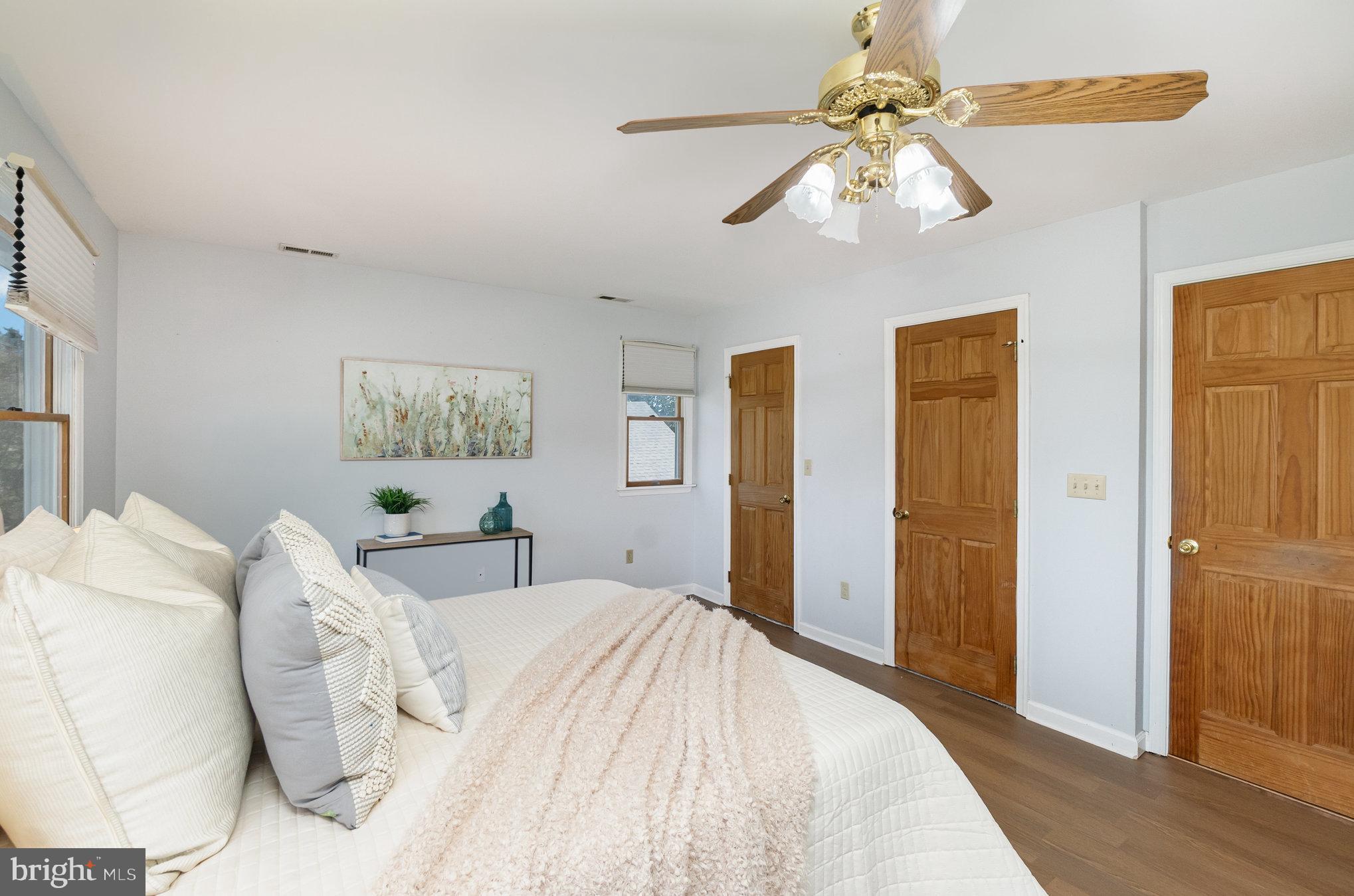 7401 Greenbank Road Baltimore, MD 21220 - Photo 23 of 58 a bedroom with a bed and a chandelier