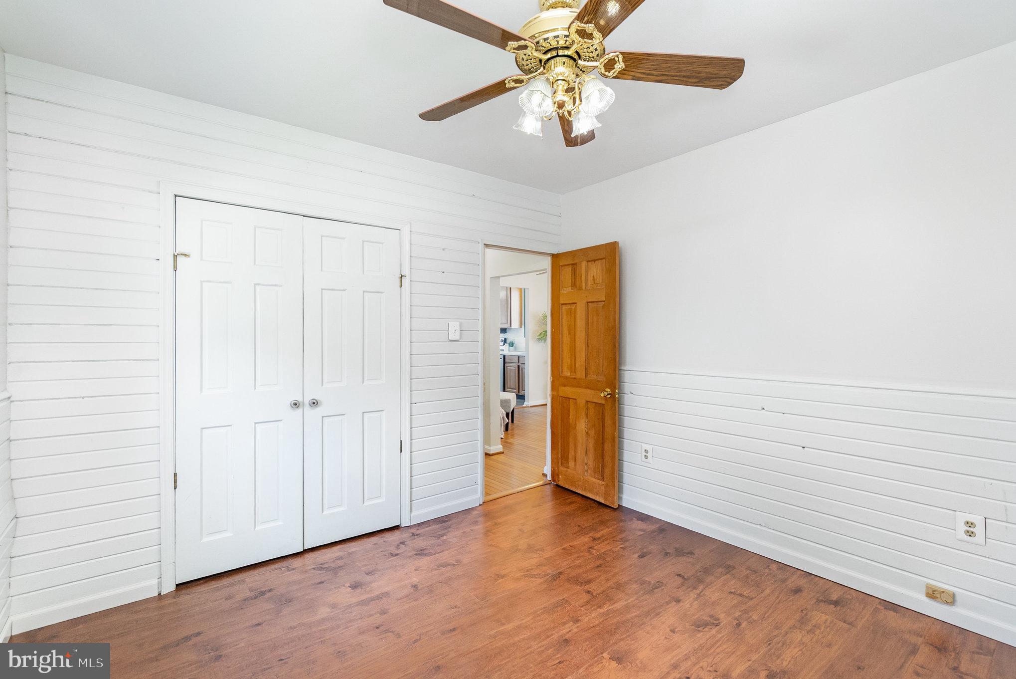 7401 Greenbank Road Baltimore, MD 21220 - Photo 35 of 58 an empty room with a ceiling fan