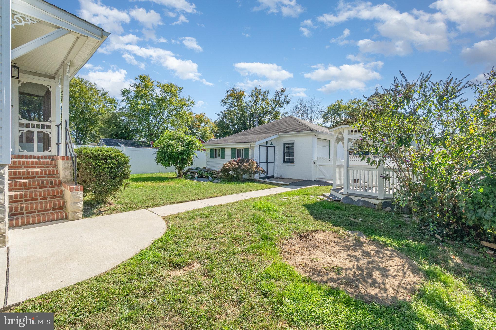 7401 Greenbank Road Baltimore, MD 21220 - Photo 42 of 58 a view of house with garden