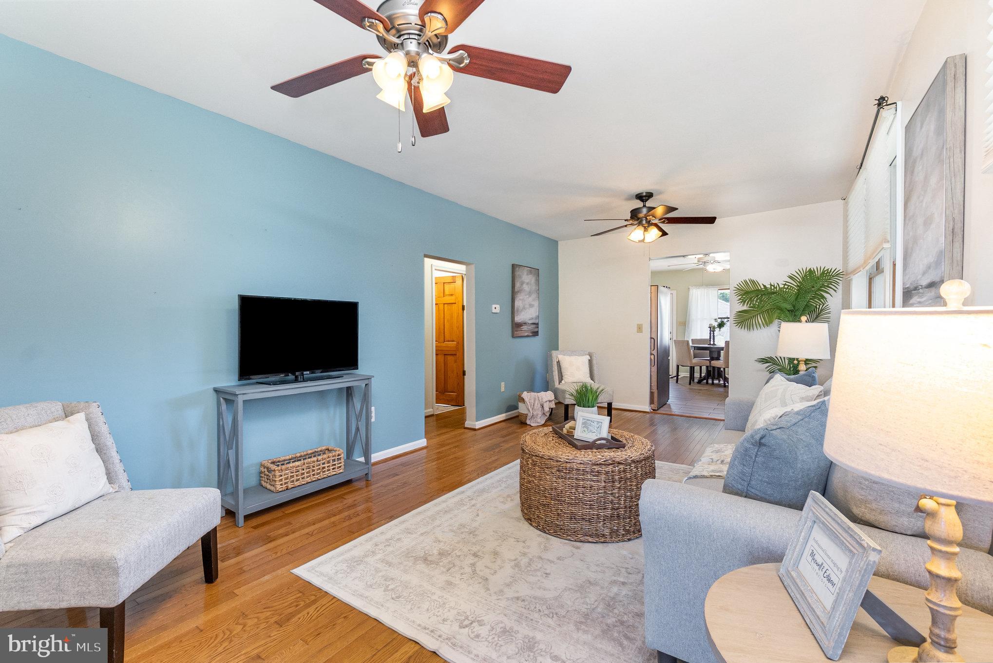 7401 Greenbank Road Baltimore, MD 21220 - Photo 7 of 58 a living room with furniture and a flat screen tv