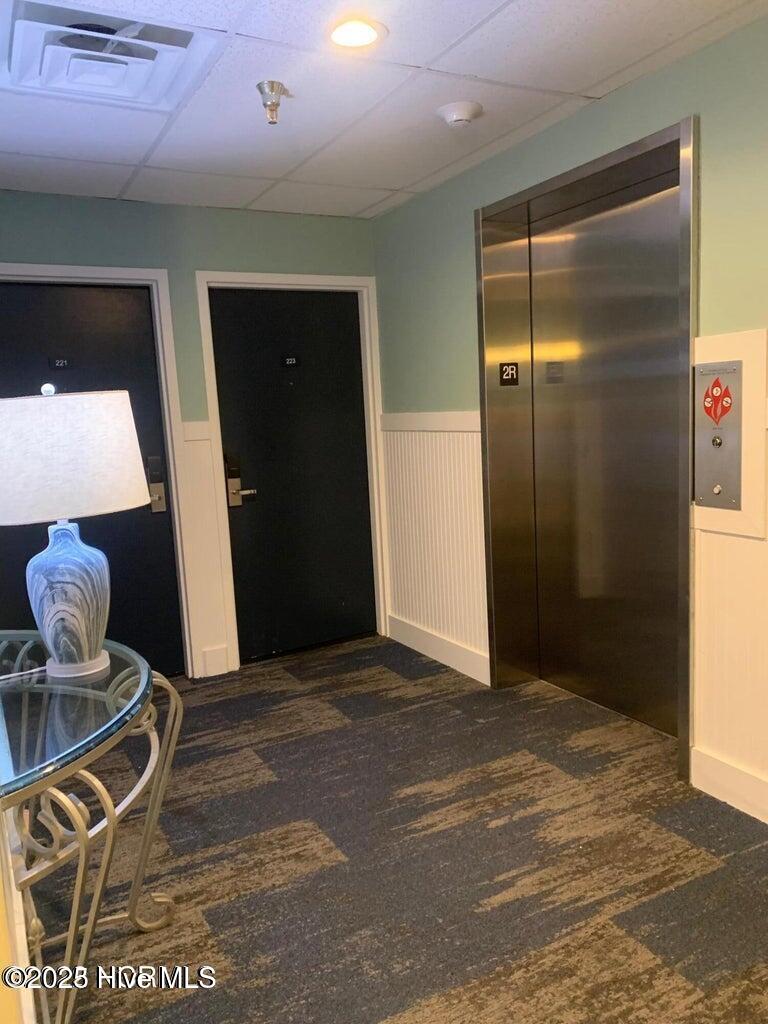602 West Fort Macon Road, Unit 249 Atlantic Beach, NC 28512 - Photo 24 of 40 Palm Suites Hallway and Elevator
