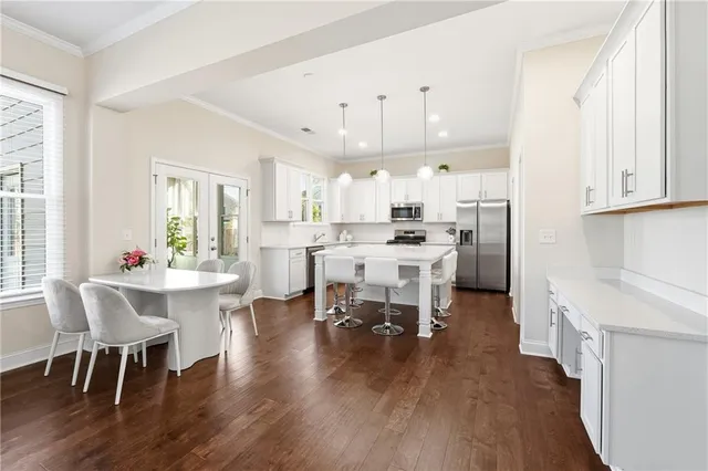 a view of a dining room with furniture and wooden floor