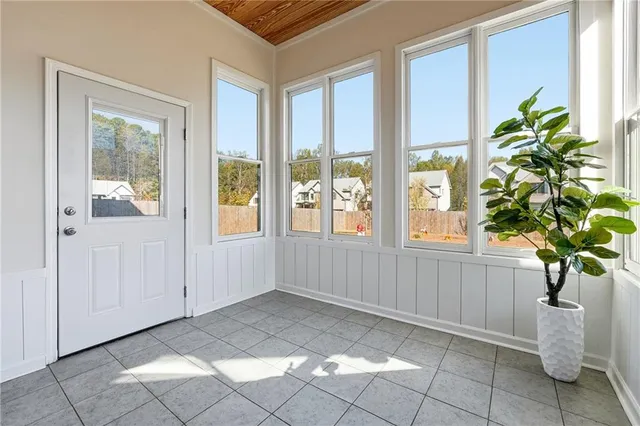 a view of an entryway with wooden floor