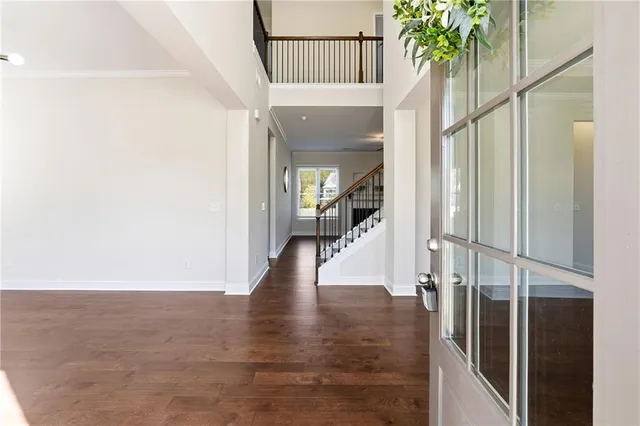 a view of a hallway view with staircase