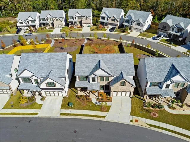 an aerial view of a house with a ocean view