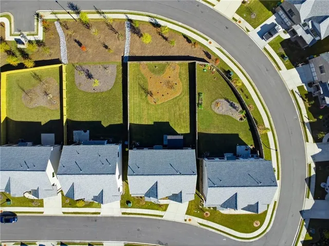 an aerial view of a house with a swimming pool