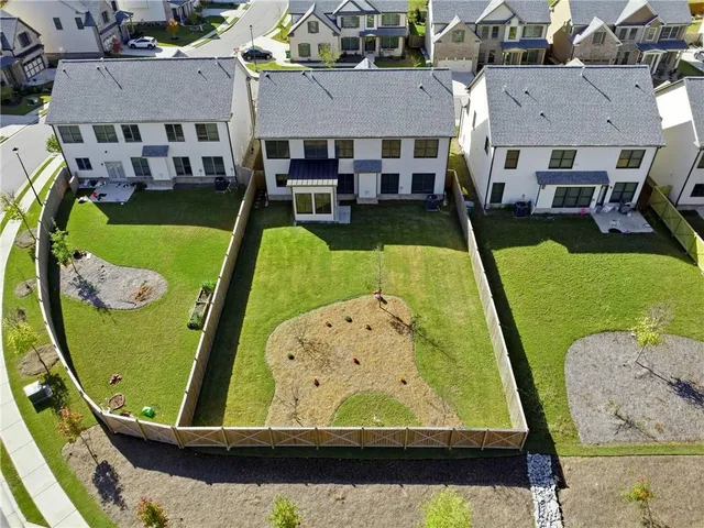 an aerial view of a house with a outdoor space