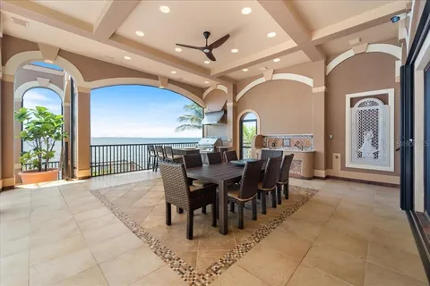 a view of a chairs and table in the balcony