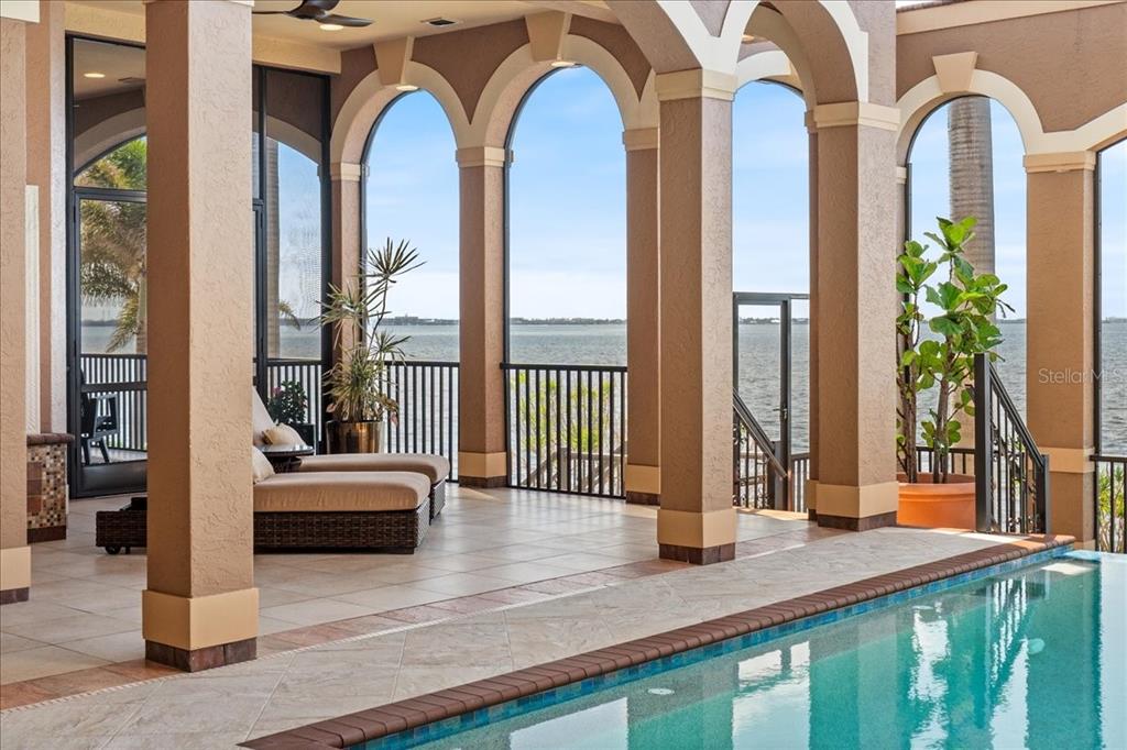 266 Bangsberg Road Southeast Port Charlotte, FL 33952 - Photo 18 of 100 a view of living room with furniture and large windows