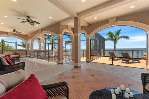 a view of a dining room with furniture and chandelier