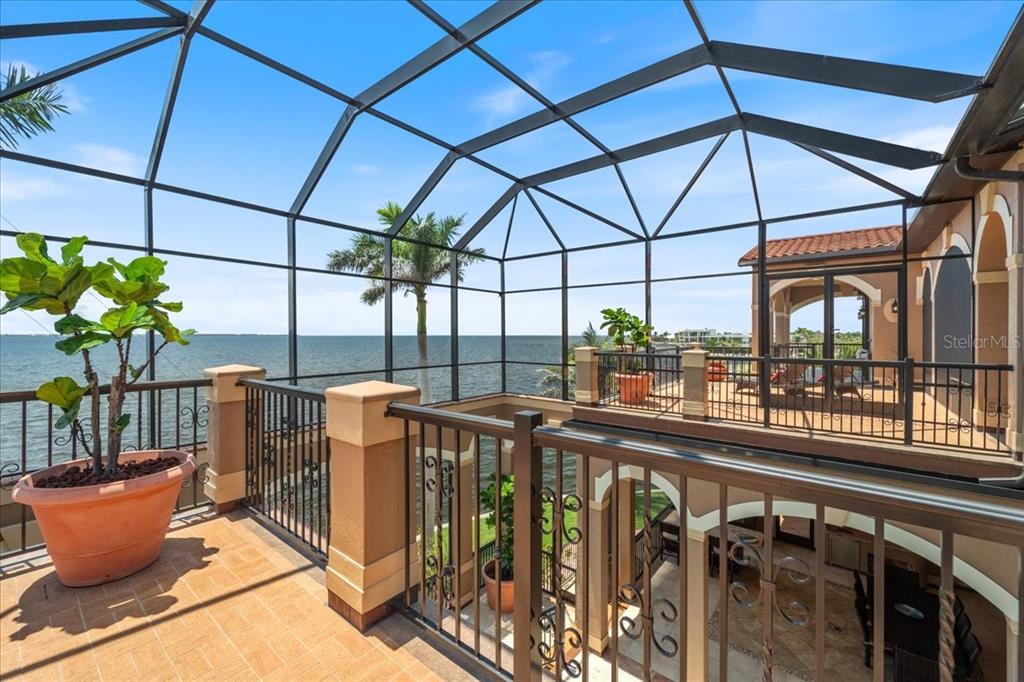 266 Bangsberg Road Southeast Port Charlotte, FL 33952 - Photo 23 of 100 a view of a chairs and table in the balcony
