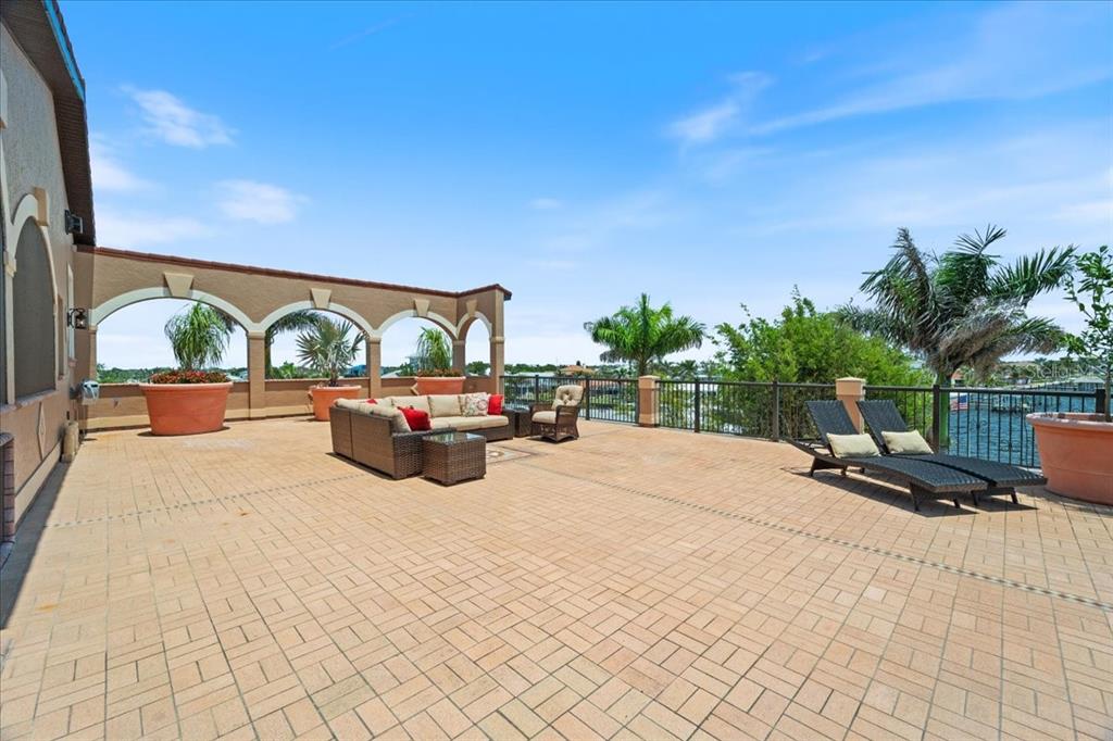 266 Bangsberg Road Southeast Port Charlotte, FL 33952 - Photo 24 of 100 a swimming pool with outdoor seating and barbeque oven